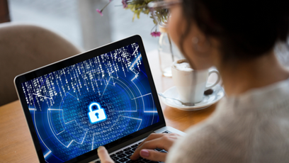 Image of a woman holding a tablet with a cybersecurity lock