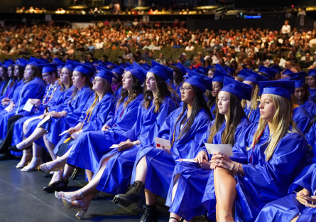 Rio Salado College students wearing graduation caps and gowns attending the 2024 commencement ceremony.  