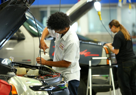 An image of automotive CTE students working on cars