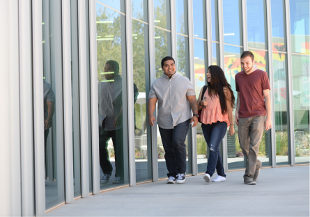 An image of three students walking together
