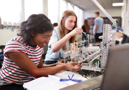 An image of two female students working together on an engineering project
