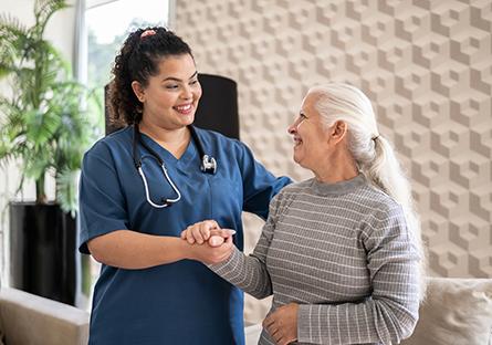 An image of a woman healthcare worker with an elderly woman.